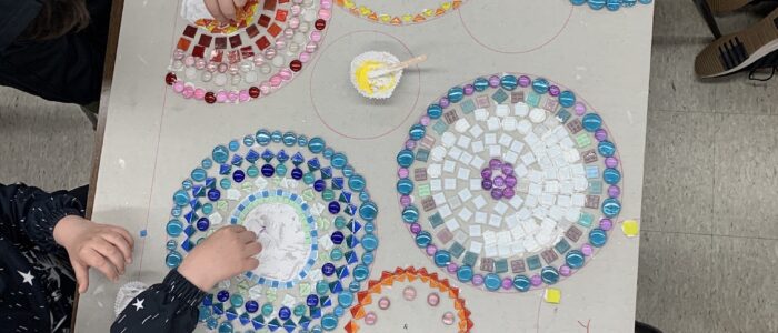 A student working on a circle mosaic project